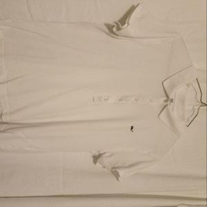 White polo sz L PTP is 20 inches